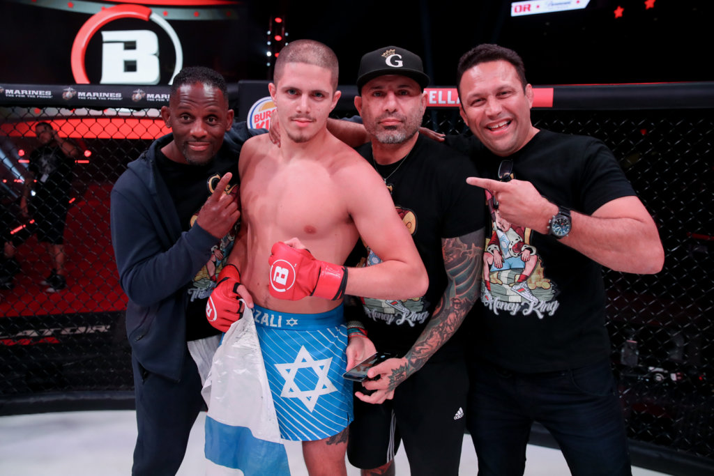 Israeli mixed martial-arts fighter Aviv Gozali with his training staff following a fight against Eduard Muravitskiy. Credit: Courtesy.
